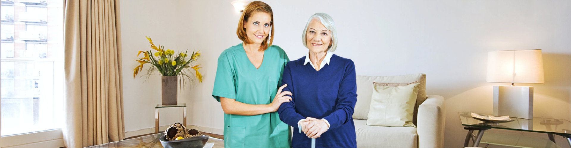 caregiver and senior woman smiling